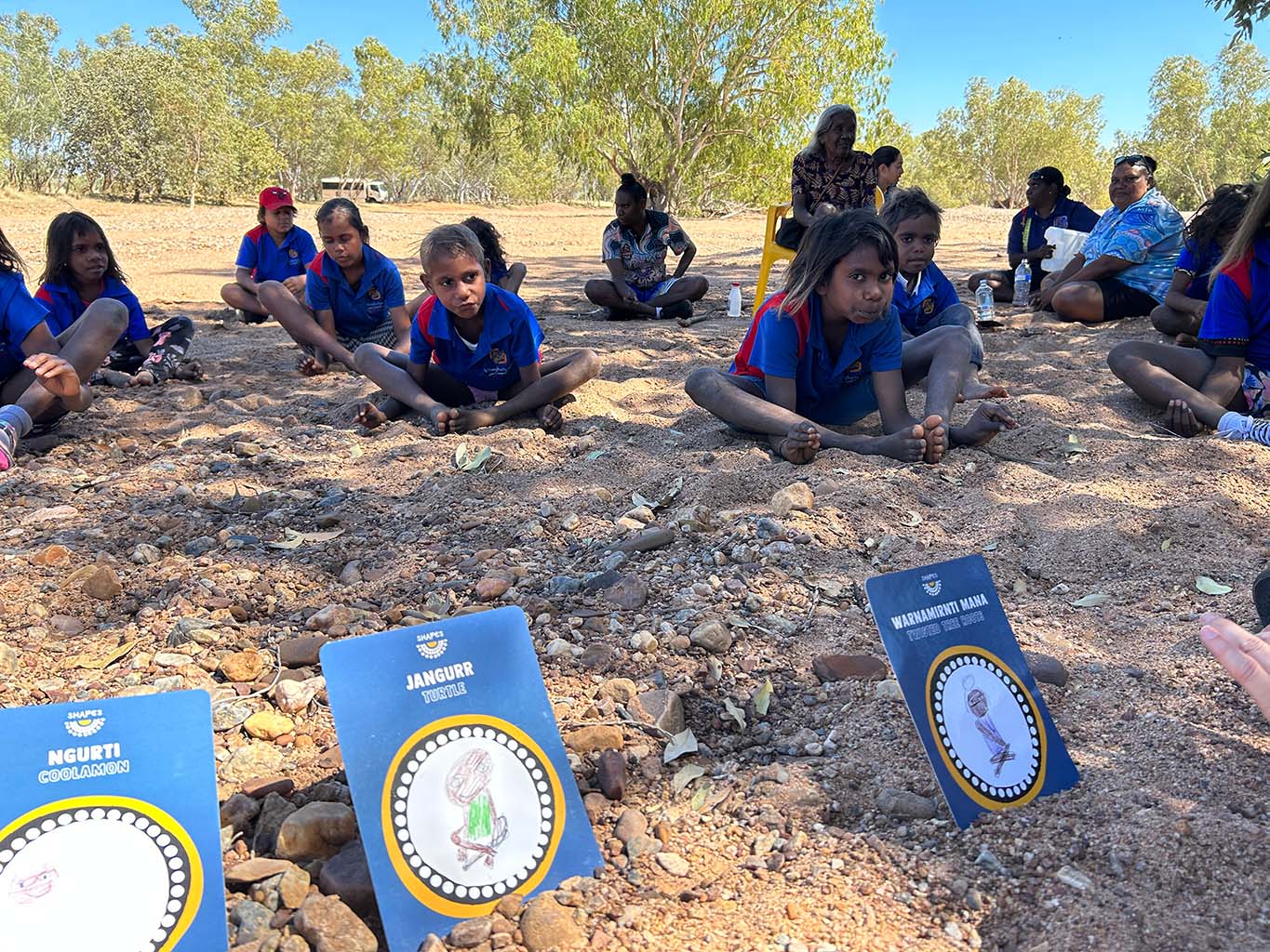 Participants sit in a Yoga Tent at Karijini National Park as the sunsets